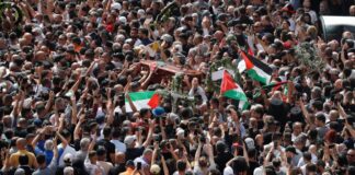 Death of Shireen Abu Akleh: Israeli police disperse crowd as Palestinian journalist exits coffin from hospital