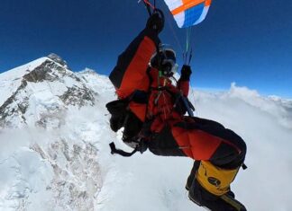 South African Pierre Carter becomes the first to legally launch a paraglider from a summit of Everest