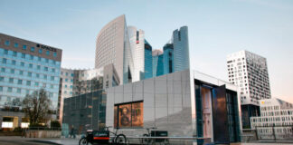 The wheel turns at La Défense: the business district seen from the bicycle repair shop