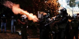 Sri Lanka’s president on the run, his official residence invaded by protesters