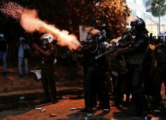 Sri Lanka’s president on the run, his official residence invaded by protesters