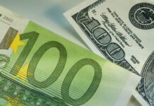The euro reaches parity with the dollar, a first since its introduction